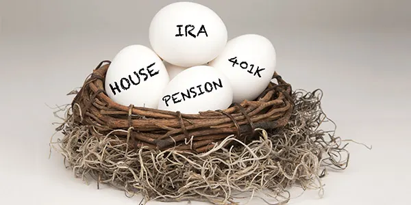 Nest egg labeled house, IRA, 401k and pension