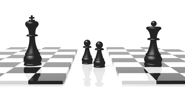 Chess pieces facing each other across a board
